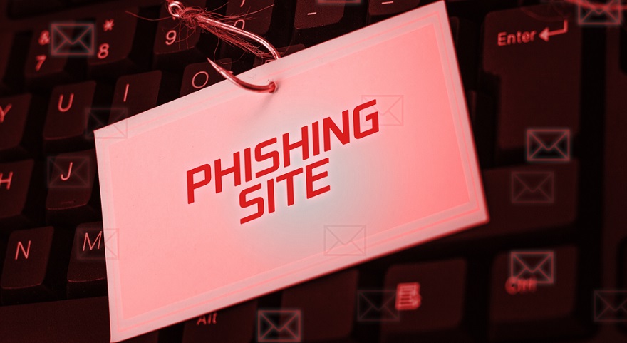 Keyboard with fishing hook through a label saying "Phishing Site"