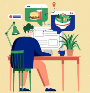 A person sitting in a chair looking at pictures of food on a computer.