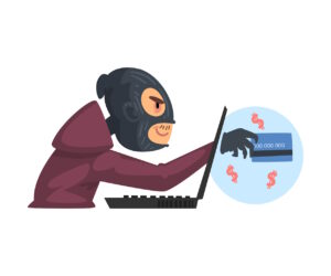 A hacker wearing gloves and a mask is stealing a credit card by breaking into a laptop.
