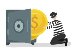 A criminal, wearing a mask removing a large gold coin from an open safe.